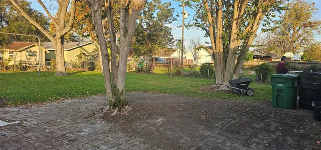 a view of a park with large trees