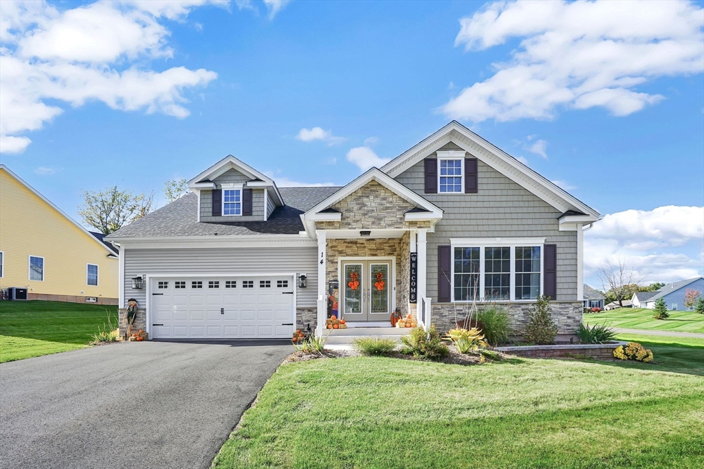 a view of a house with a yard