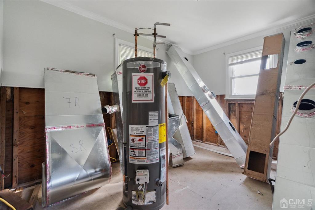 212 Huff Avenue Manville, NJ 08835 - Photo 20 of 22 a view of a hallway with wooden floor and stairs