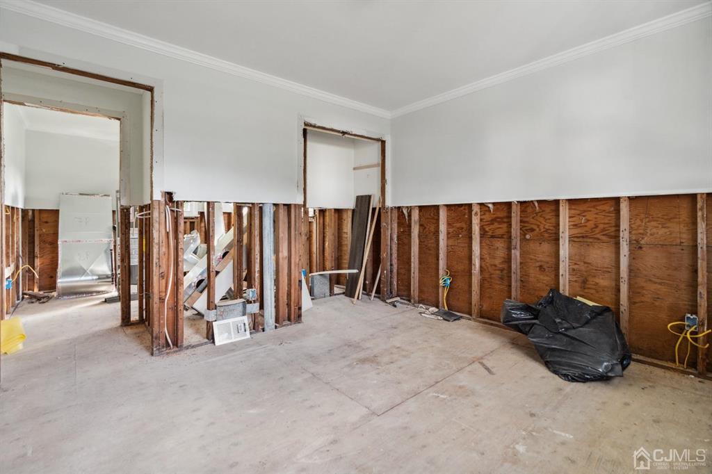 212 Huff Avenue Manville, NJ 08835 - Photo 5 of 22 a view of a room with gym equipment and a large window
