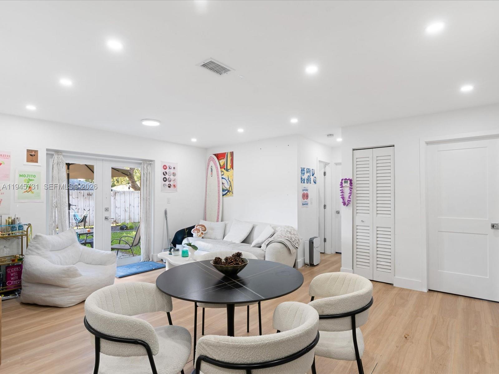 6510 Southwest 59th Place South Miami, FL 33143 - Photo 13 of 23 a living room with furniture and a wooden floor