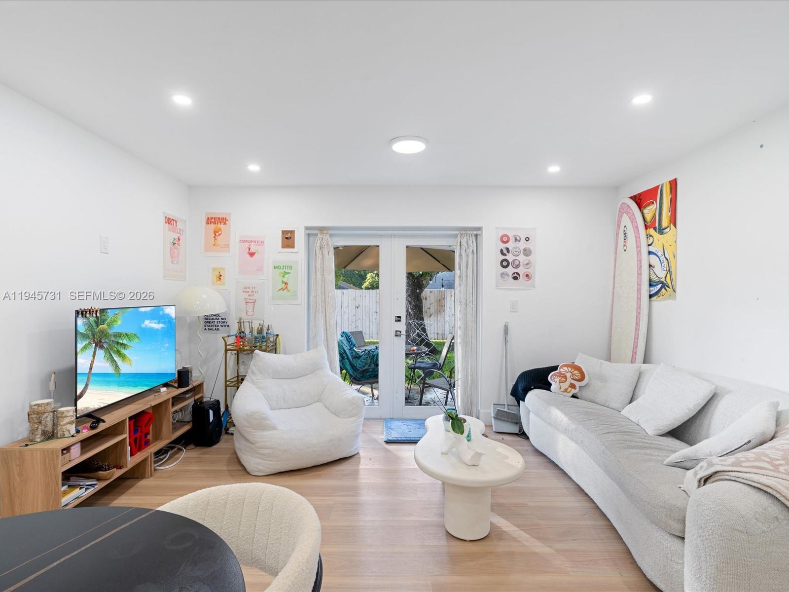 6510 Southwest 59th Place South Miami, FL 33143 - Photo 14 of 23 a living room with furniture and a flat screen tv