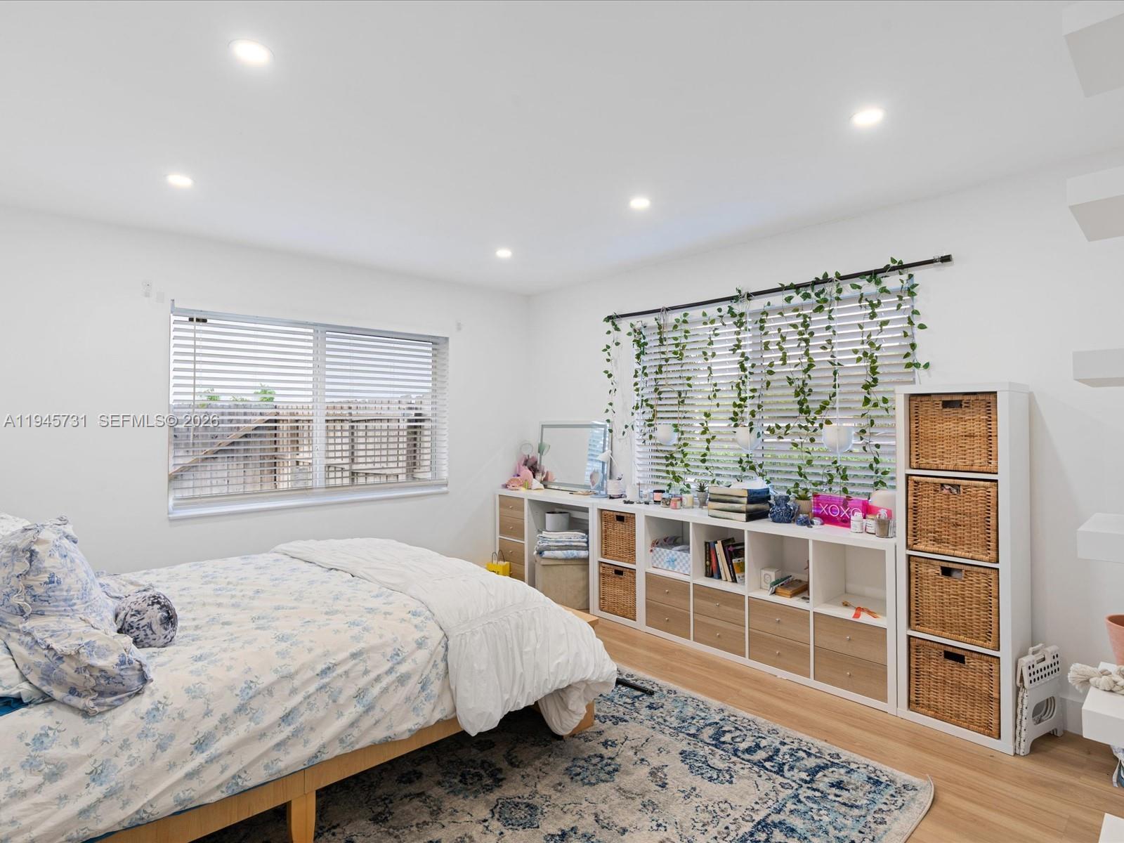 6510 Southwest 59th Place South Miami, FL 33143 - Photo 21 of 23 a bedroom with a bed and a window