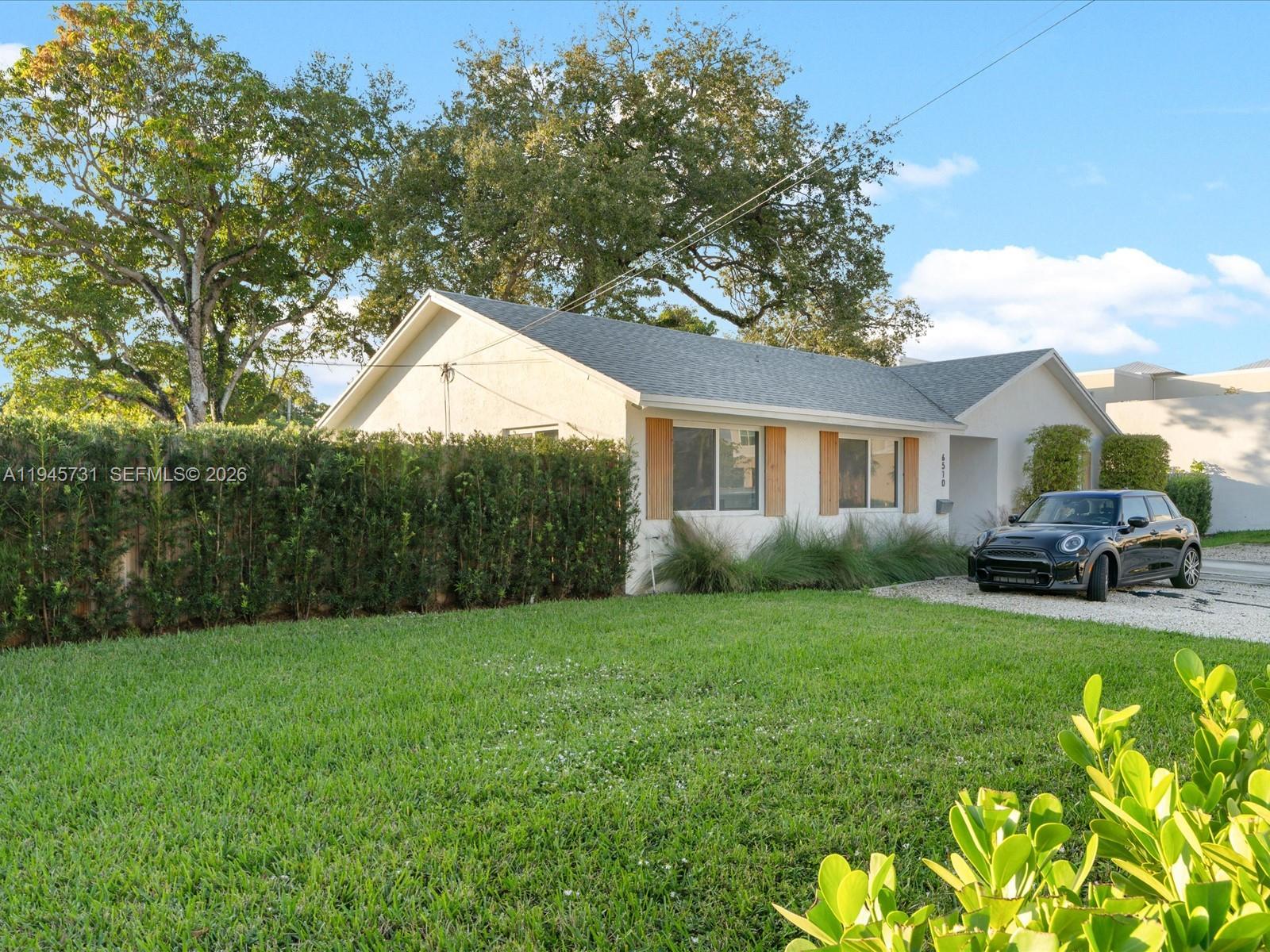 6510 Southwest 59th Place South Miami, FL 33143 - Photo 3 of 23 a house view with swimming pool in front of it