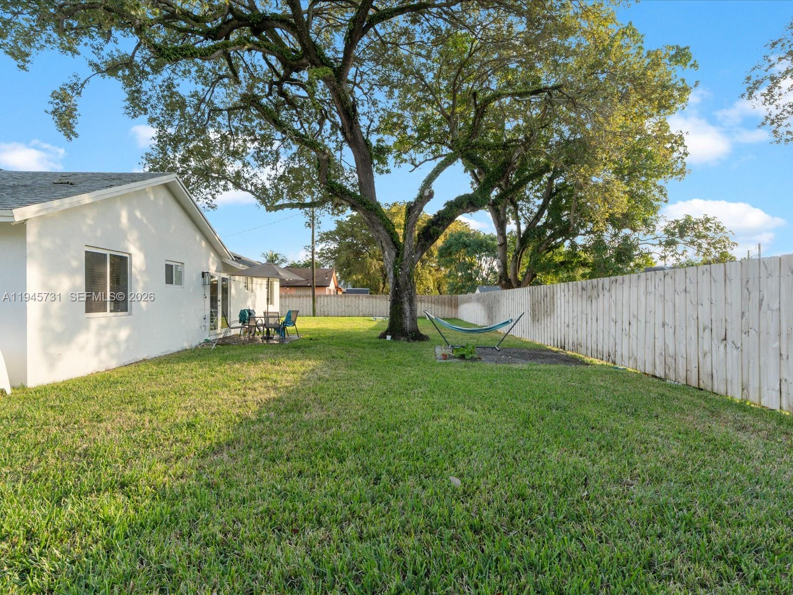 6510 Southwest 59th Place South Miami, FL 33143 - Photo 7 of 23 a view of a house with backyard and a tree