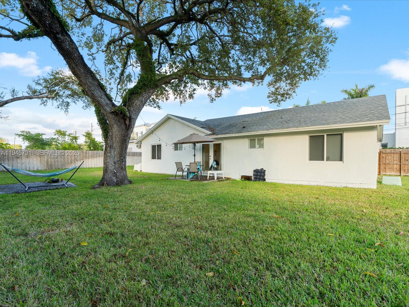 6510 Southwest 59th Place South Miami, FL 33143 - Photo 9 of 23 a view of a yard in front of a house with large trees