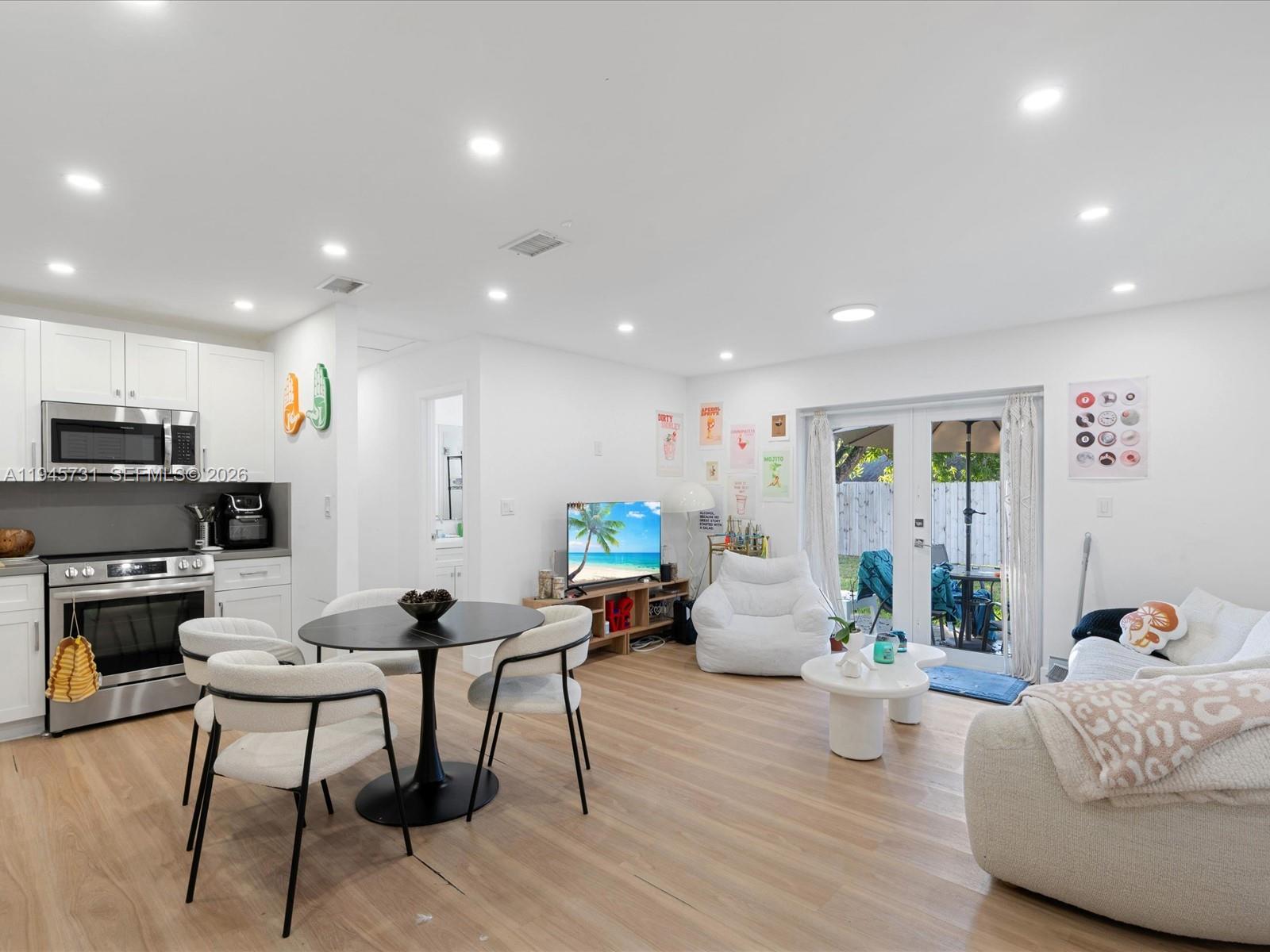 6510 Southwest 59th Place South Miami, FL 33143 - Photo 10 of 23 a living room with furniture and a fireplace