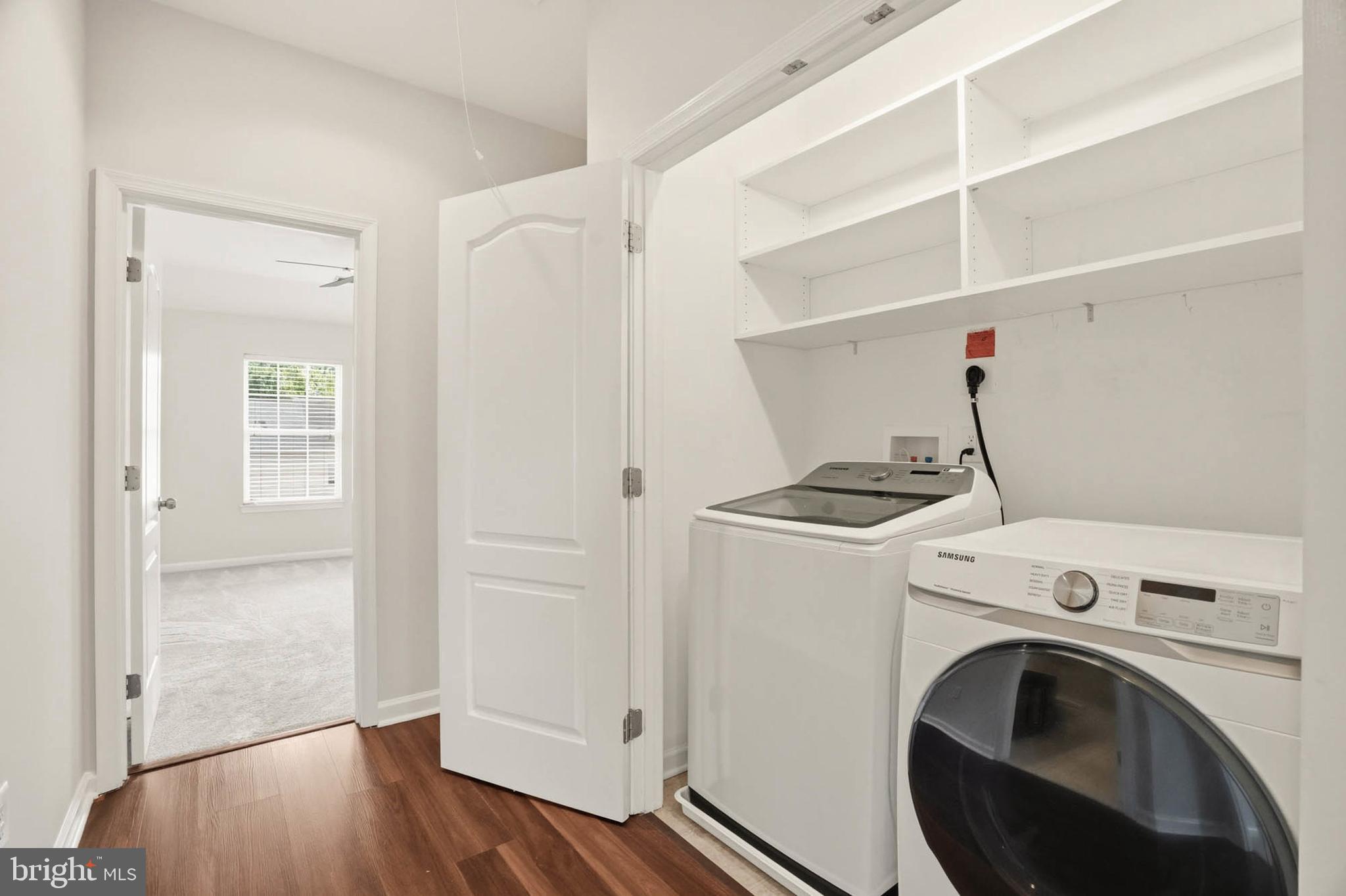 9817 Solar Course Laurel, MD 20723 - Photo 27 of 59 a view of storage and utility room with washer and dryer