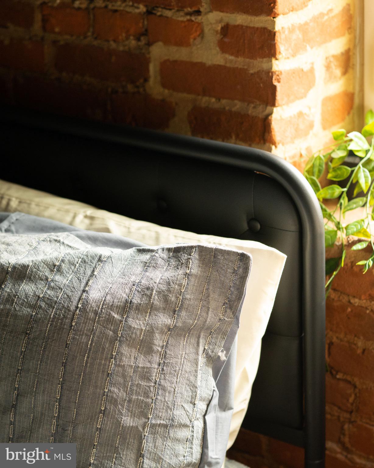 437 West Grant Street, Unit 304 Lancaster, PA 17603 - Photo 16 of 37 a black and white building with trees in the background