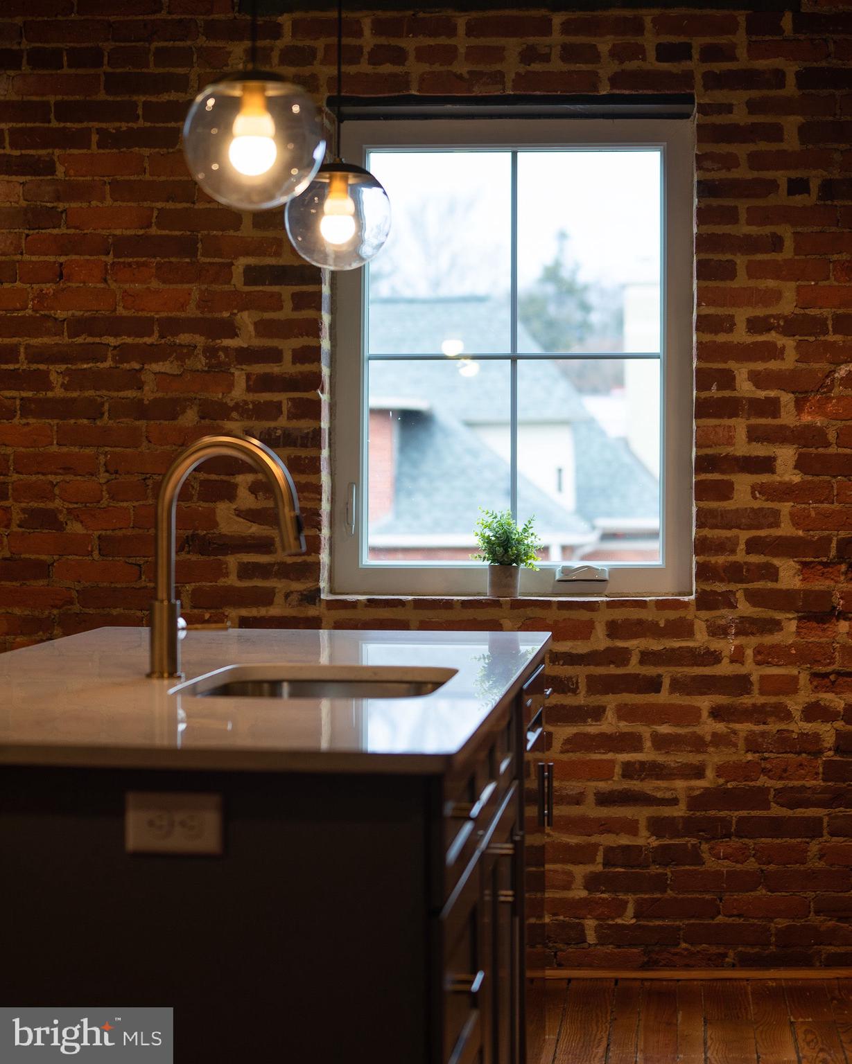 437 West Grant Street, Unit 304 Lancaster, PA 17603 - Photo 25 of 37 a kitchen with a sink and a window