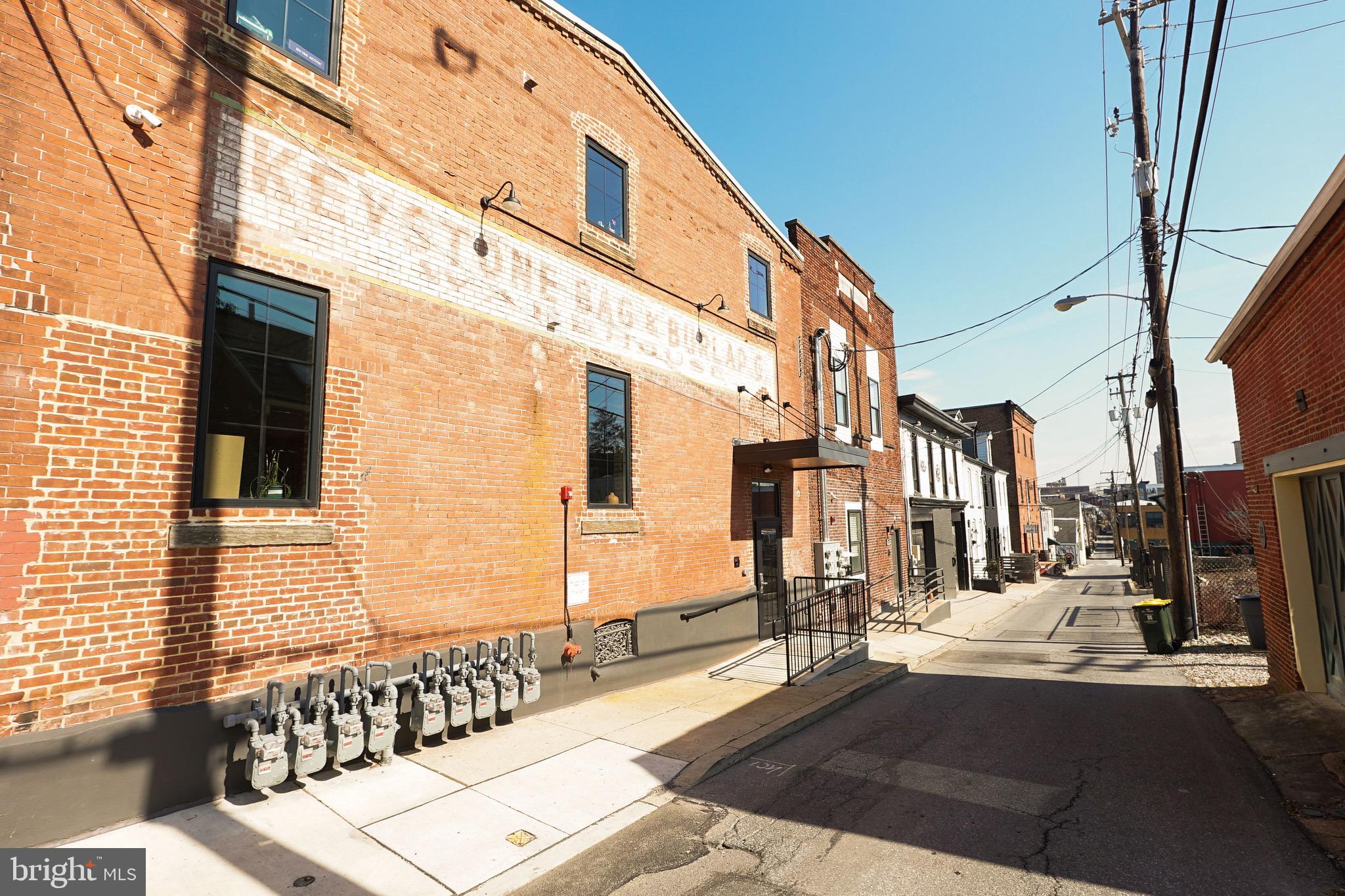 437 West Grant Street, Unit 304 Lancaster, PA 17603 - Photo 37 of 37 a view of a brick building with many windows