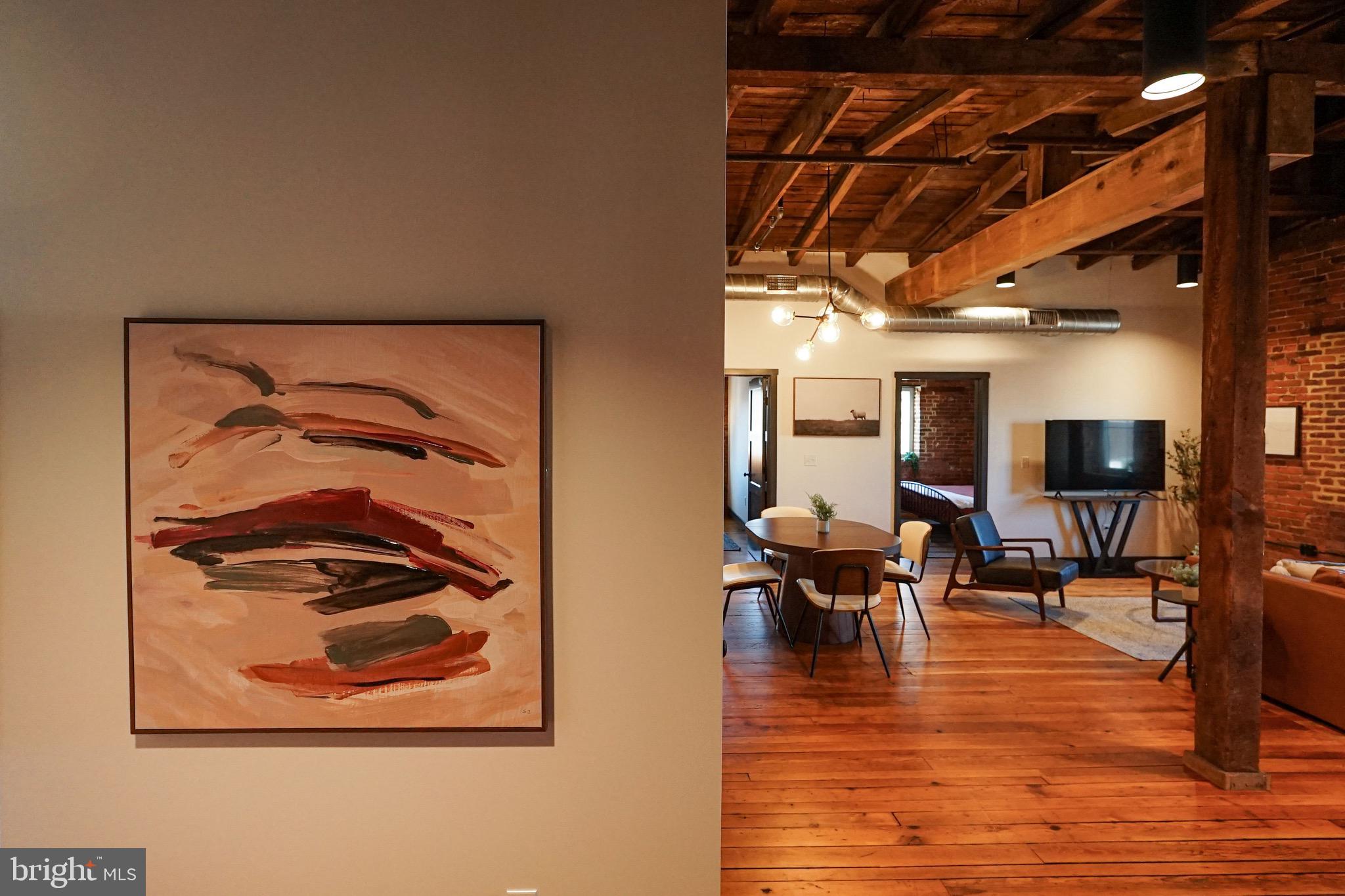 437 West Grant Street, Unit 304 Lancaster, PA 17603 - Photo 9 of 37 a view of a living room and dining room