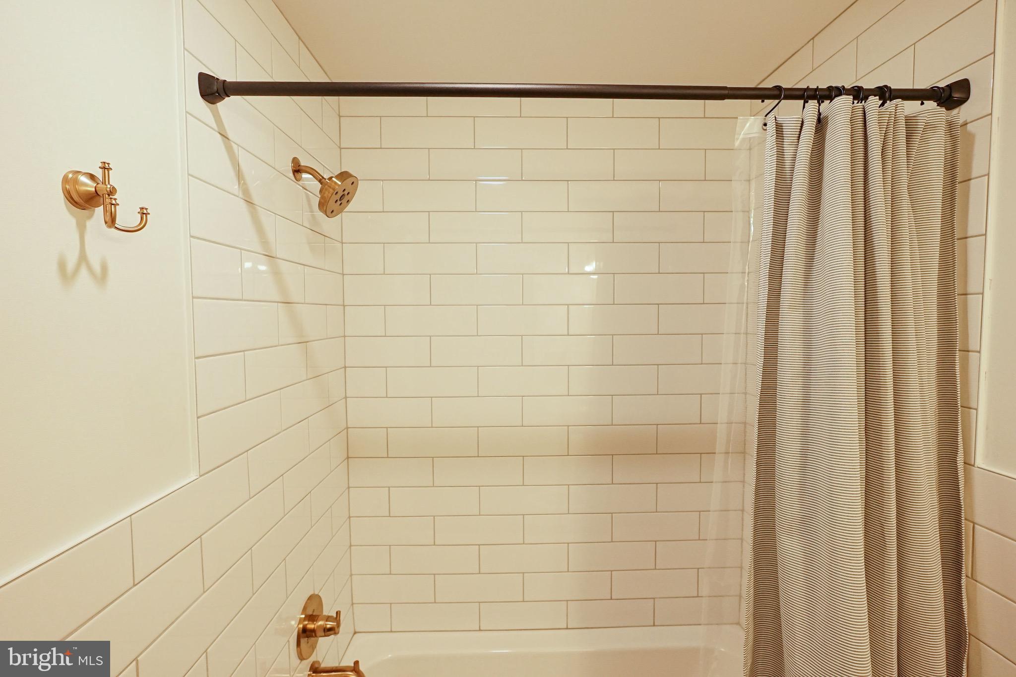 437 West Grant Street, Unit 304 Lancaster, PA 17603 - Photo 10 of 37 a bathroom with a shower