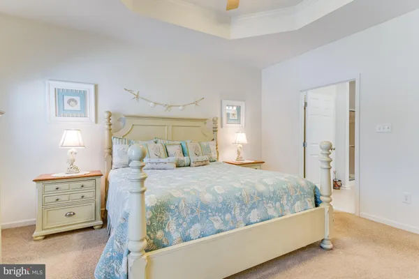 a bedroom with a bed and a table