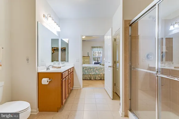 a kitchen with stainless steel appliances granite countertop a refrigerator and a stove