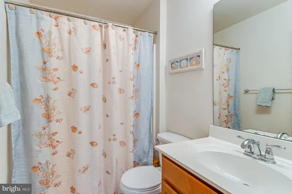 a large bed sitting in a bedroom next to a window