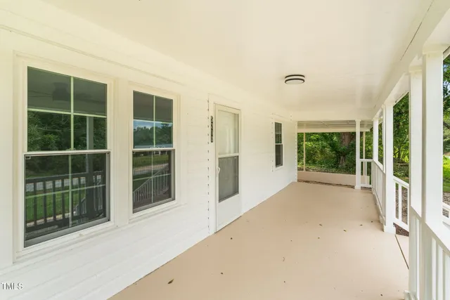 a view of an empty room with a large window