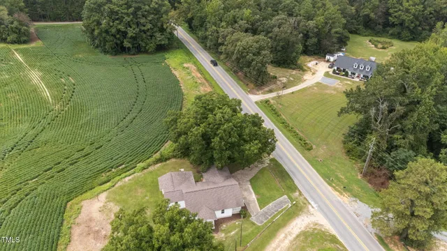a view of a swimming pool with a yard