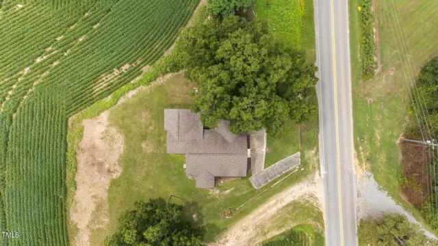 swimming pool view with a garden