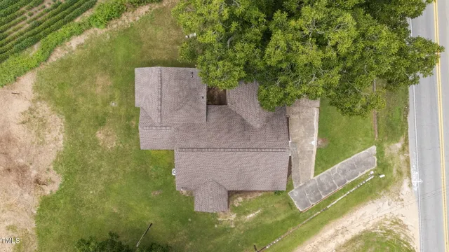 a aerial view of a house with a yard