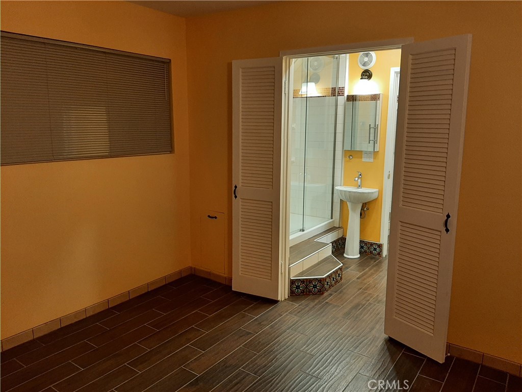 12592 Montecito Road, Unit 9 Seal Beach, CA 90740 - Photo 16 of 34 a view of a bathroom with a sink and a mirror