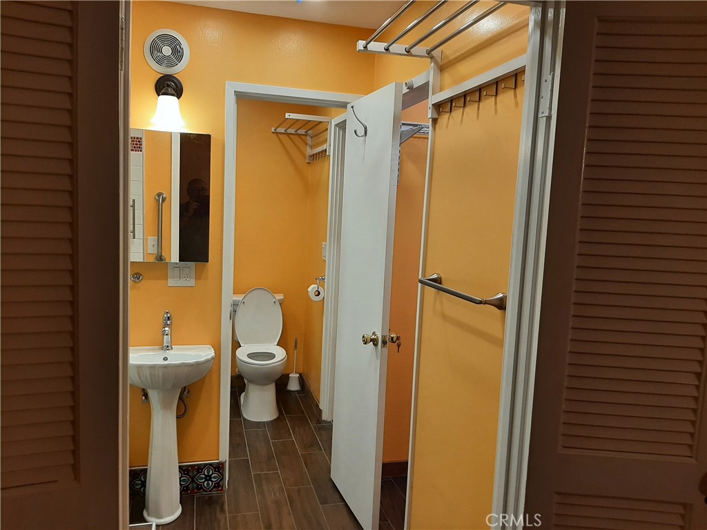 12592 Montecito Road, Unit 9 Seal Beach, CA 90740 - Photo 17 of 34 a bathroom with a toilet a sink and shower