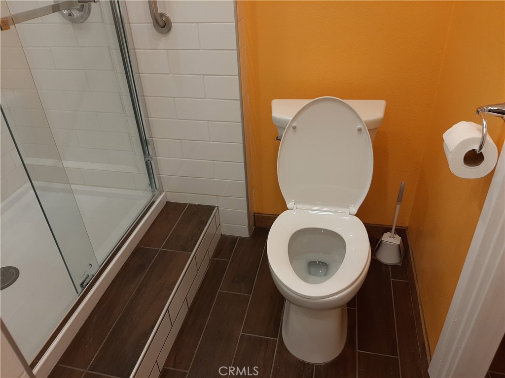 12592 Montecito Road, Unit 9 Seal Beach, CA 90740 - Photo 22 of 34 a bathroom with a toilet and a mirror