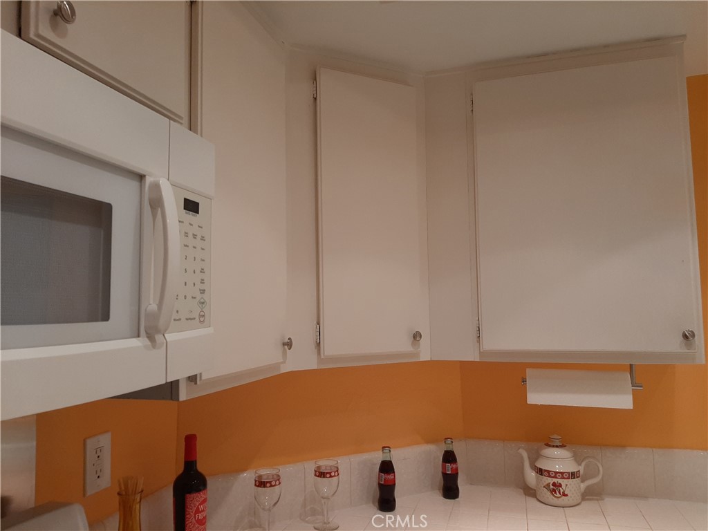 12592 Montecito Road, Unit 9 Seal Beach, CA 90740 - Photo 25 of 34 a bathroom with a tub and cabinets