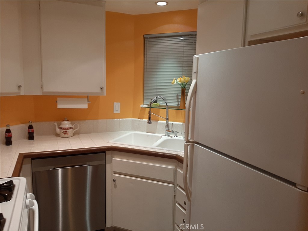 12592 Montecito Road, Unit 9 Seal Beach, CA 90740 - Photo 29 of 34 a utility room with dryer and washer