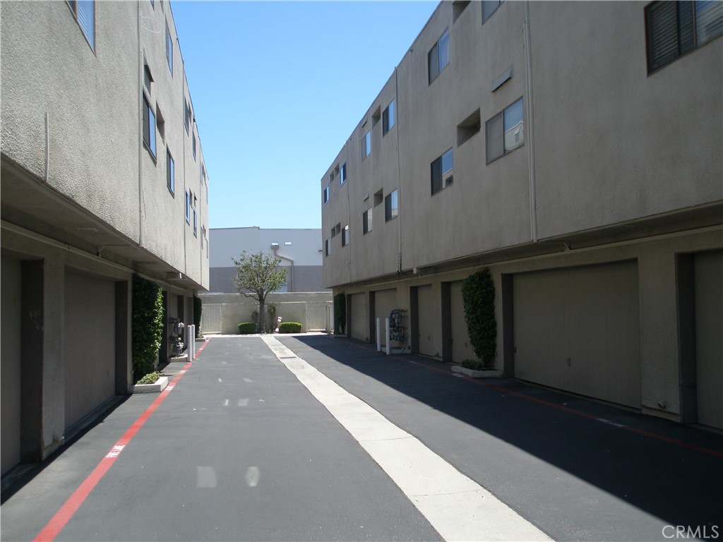 12592 Montecito Road, Unit 9 Seal Beach, CA 90740 - Photo 3 of 34 a view of a building with a street