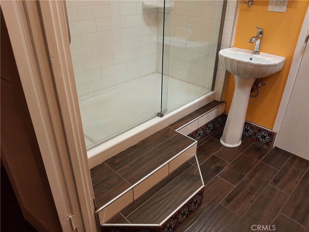 12592 Montecito Road, Unit 9 Seal Beach, CA 90740 - Photo 32 of 34 a bathroom with a sink and mirror