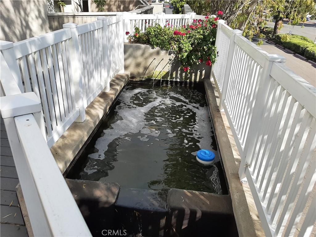 12592 Montecito Road, Unit 9 Seal Beach, CA 90740 - Photo 4 of 34 a view of balcony with wooden floor