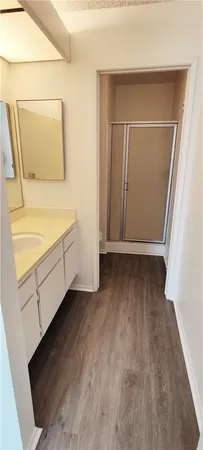 a view of walk in closet with empty racks