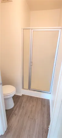 a bathroom with a toilet a sink and a shower