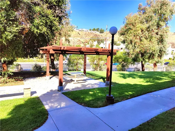a view of a park with large trees