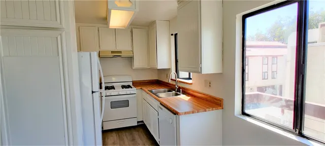 a kitchen with a stove and a refrigerator