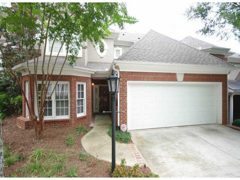 121 Brookview Circle, Unit 121 Atlanta, GA 30339 - Photo 1 of 1 a front view of a house with garden
