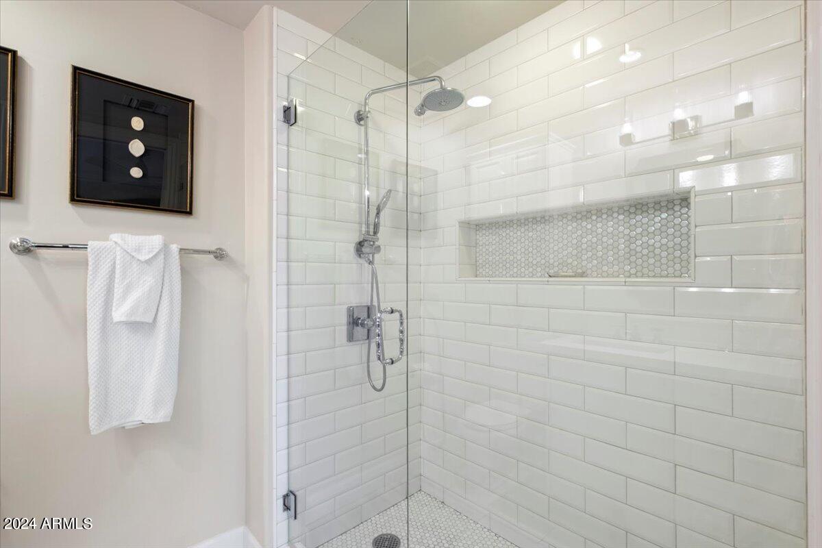 7175 East Camelback Road, Unit 107 Scottsdale, AZ 85251 - Photo 12 of 33 a bathroom with a shower and a sink