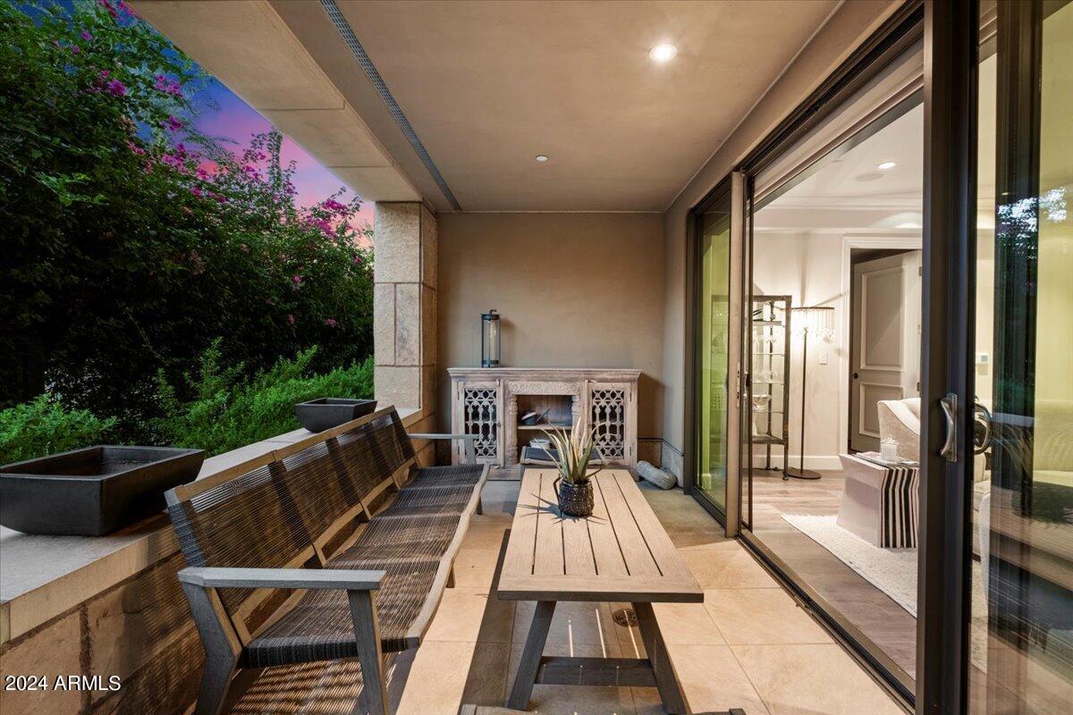7175 East Camelback Road, Unit 107 Scottsdale, AZ 85251 - Photo 18 of 33 a view of balcony with wooden floor and outdoor seating