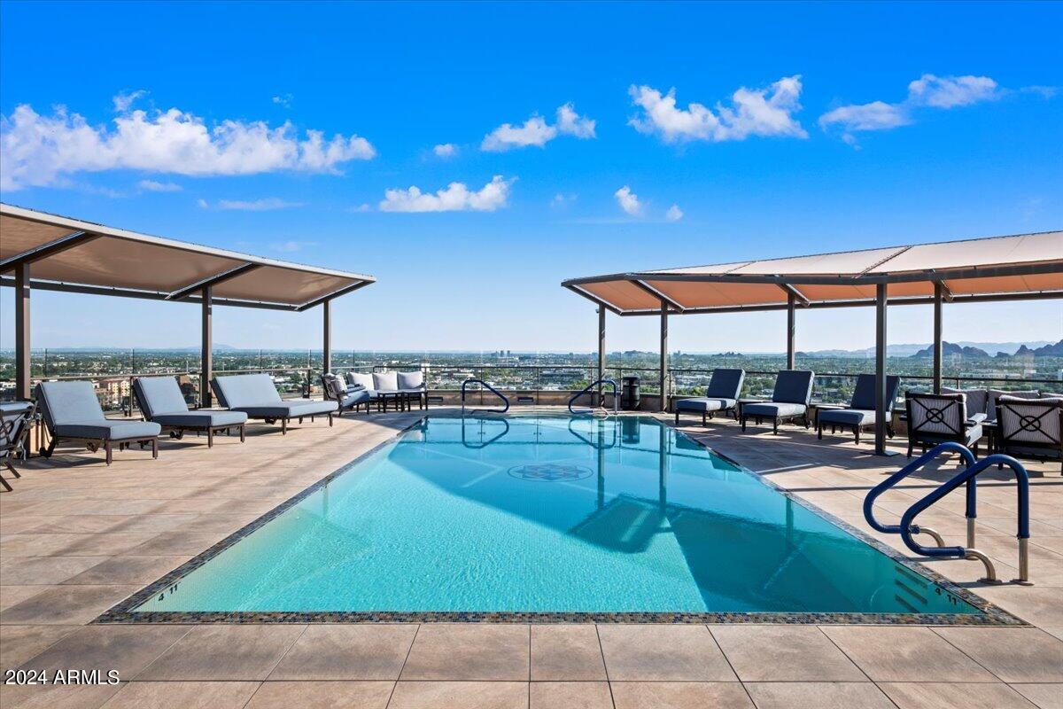 7175 East Camelback Road, Unit 107 Scottsdale, AZ 85251 - Photo 19 of 33 a view of a patio with swimming pool