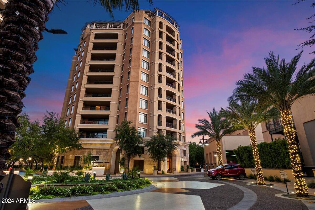 7175 East Camelback Road, Unit 107 Scottsdale, AZ 85251 - Photo 28 of 33 a city street lined with buildings and trees