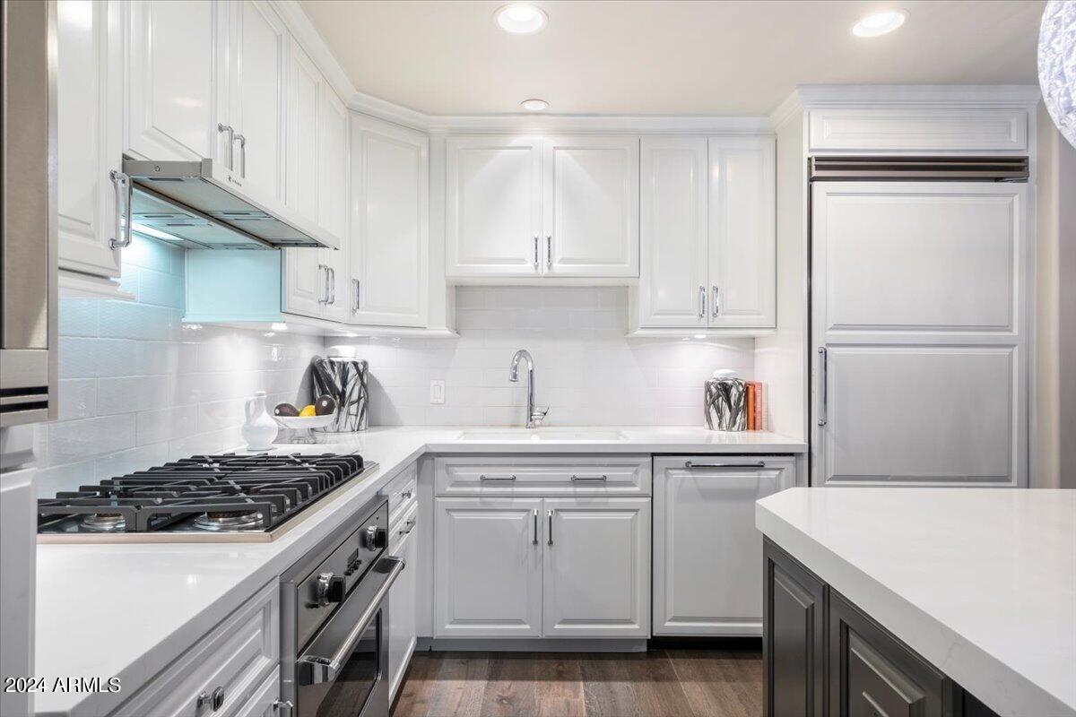 7175 East Camelback Road, Unit 107 Scottsdale, AZ 85251 - Photo 7 of 33 a kitchen with a sink a stove and refrigerator