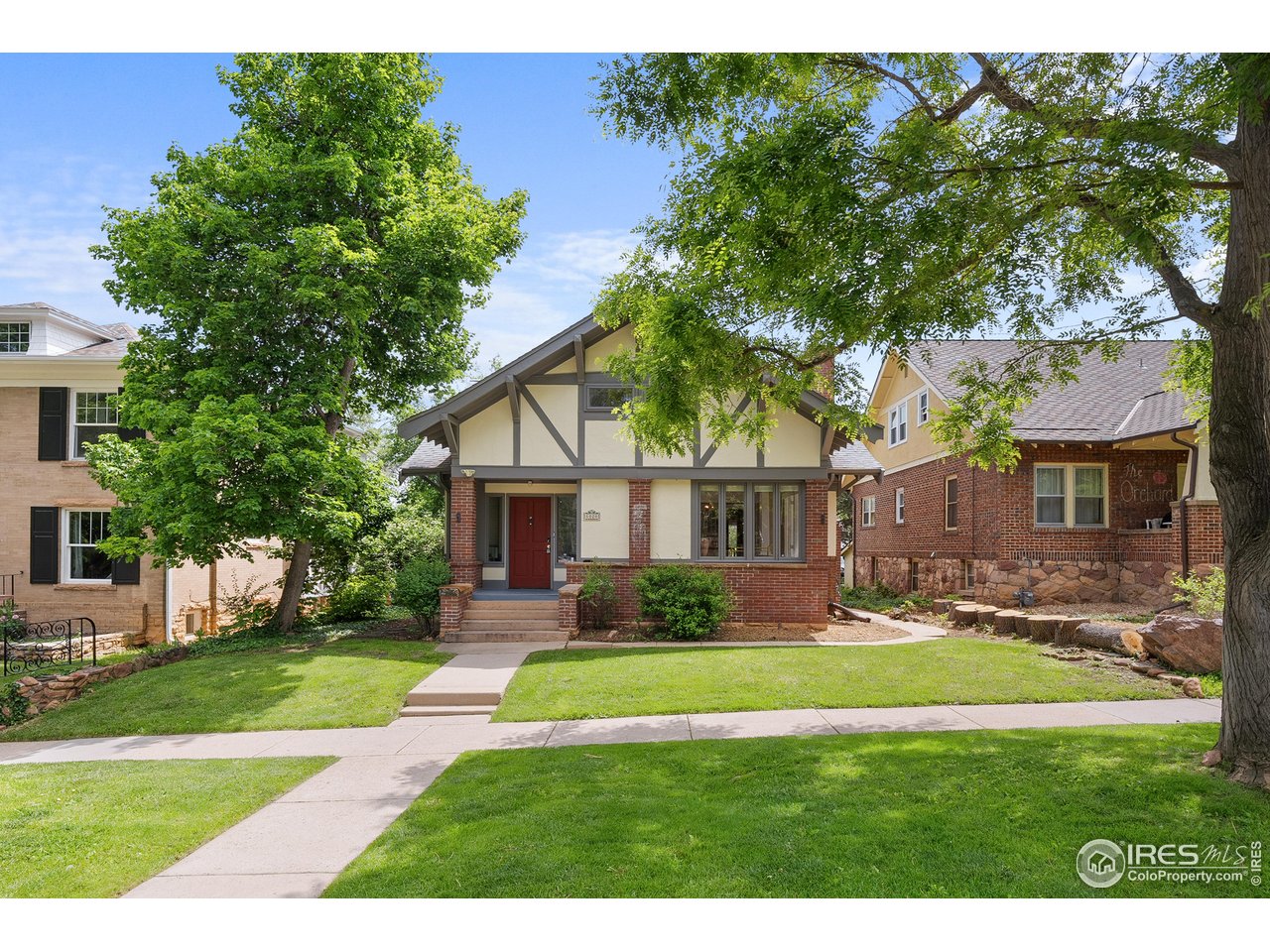 1020 10th Street Boulder, CO 80302 - Photo 2 of 38 a front view of house with yard and green space