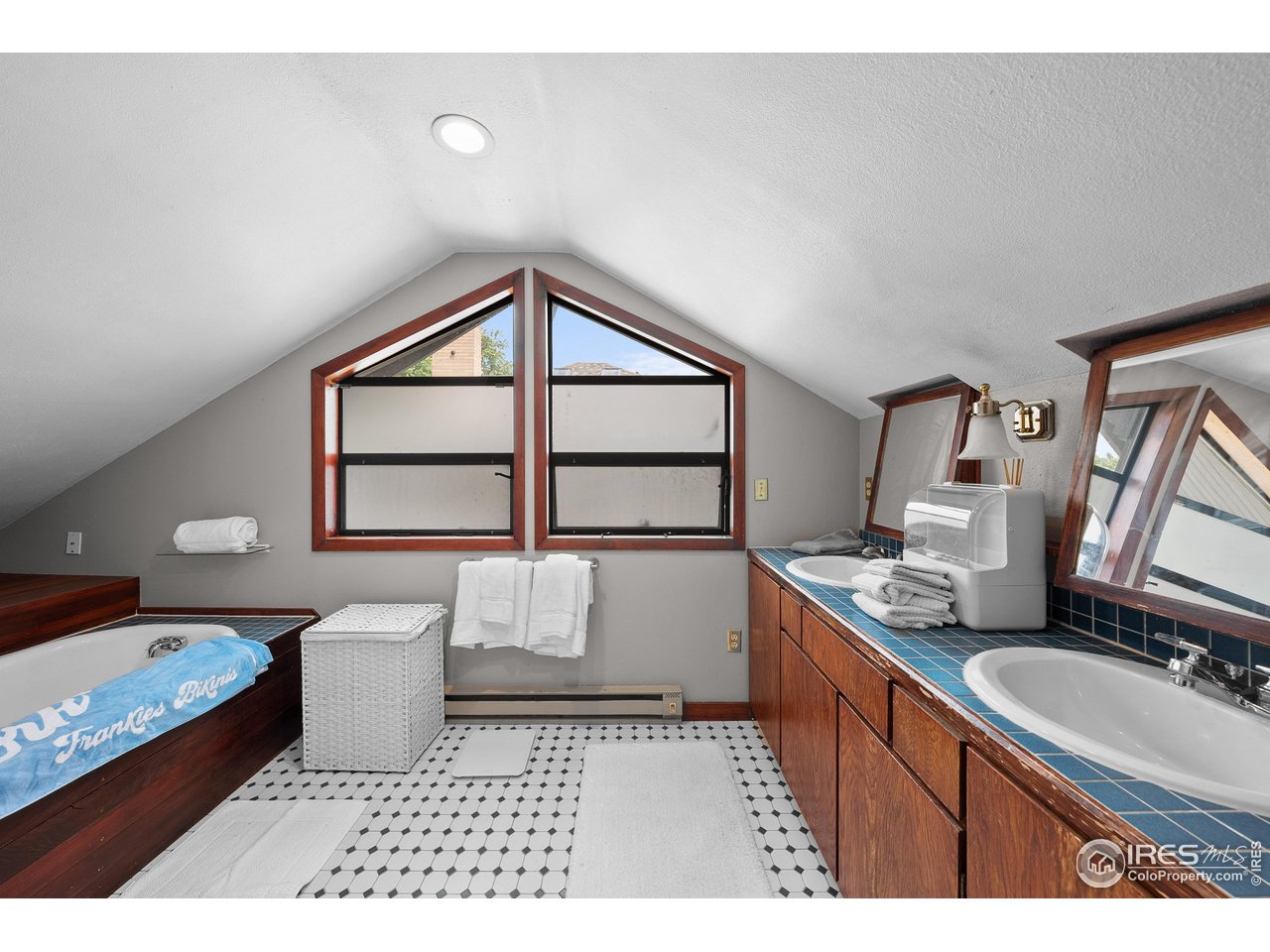 1020 10th Street Boulder, CO 80302 - Photo 24 of 38 a bathroom with a sink toilet and mirror