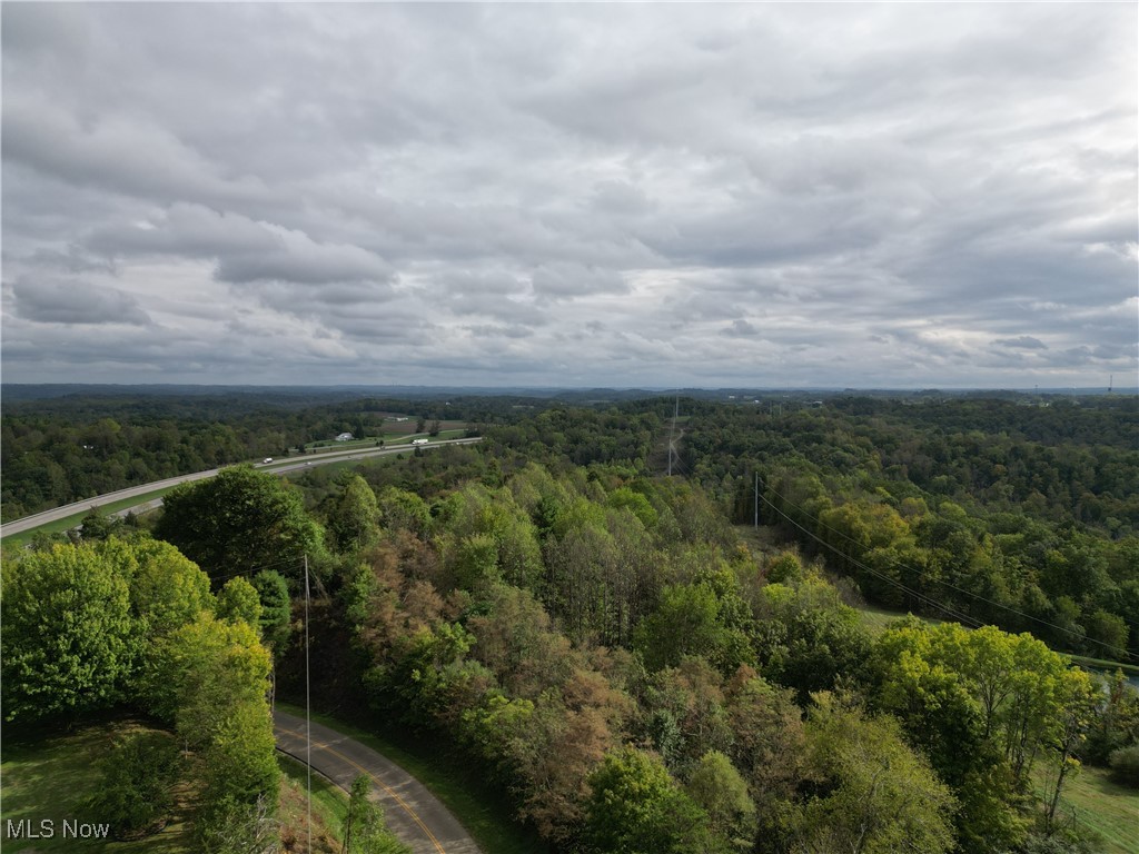 3275 Highland Ridge Road Lowell, OH 45744 - Photo 3 of 10 Drone / aerial view of a heavily wooded area