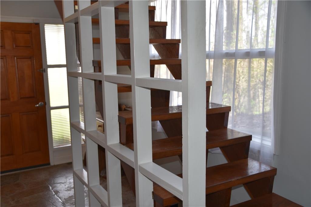 420 Highview Road Wexford, PA 15090 - Photo 15 of 25 Lower level entry and stairway. This door takes you to a concrete patio rear of home, to the right, around the corner are stair that take you to the breezeway area and to the front of the home.