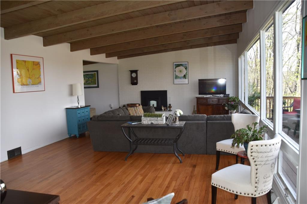 420 Highview Road Wexford, PA 15090 - Photo 3 of 25 This Living Room is just... WOW! 30+ Foot of floor to ceiling windows, exposed beam ceiling, beautiful hardwood floors!