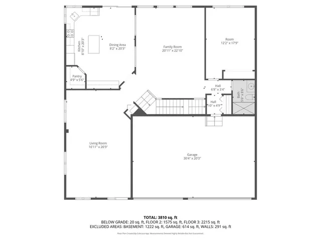 an empty room with furniture and kitchen view