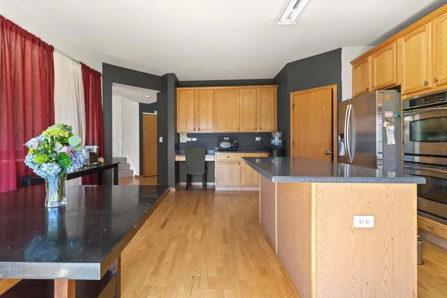 a living room with furniture window and a flat screen tv