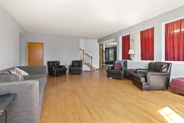 a bathroom with a sink vanity mirror and toilet